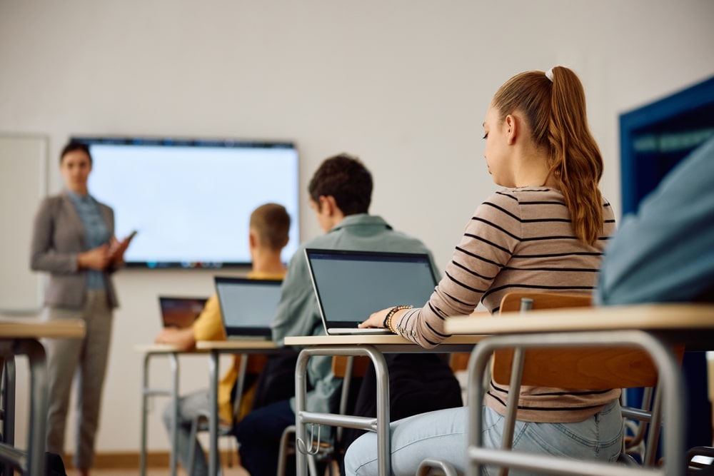 Student using a refurbished laptop for online classes